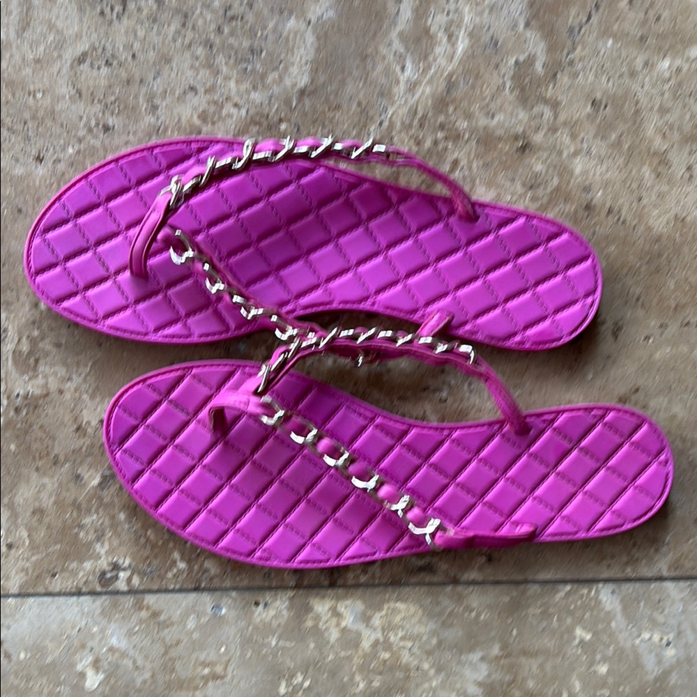 Pink chain detail flip flops